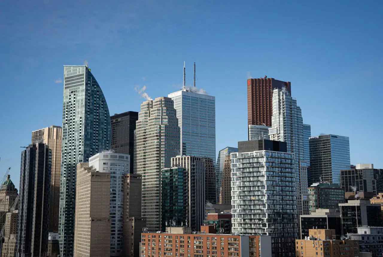 Modern city skyline with high-rise buildings under a clear blue sky